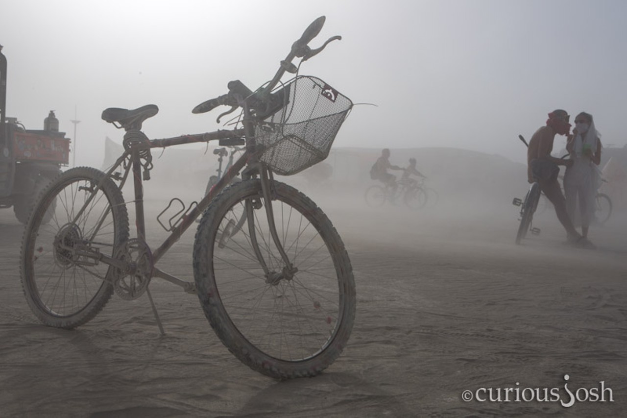 A bike, Black Rock City's most popular form of transportation, sits at center camp during one of the week's dust storms