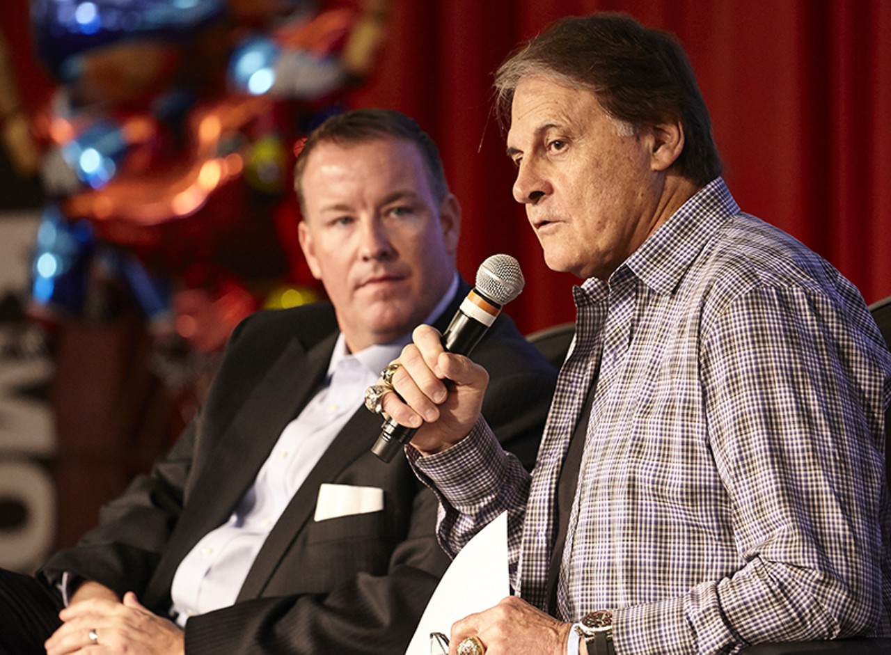 Fox Sports Midwest announcer Dan McLaughlin and former Cardinals manager Tony LaRussa address the crowd.