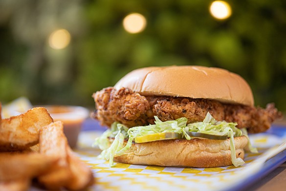 Crispy chicken sandwich with chicken breast, dill pickles and lettuce