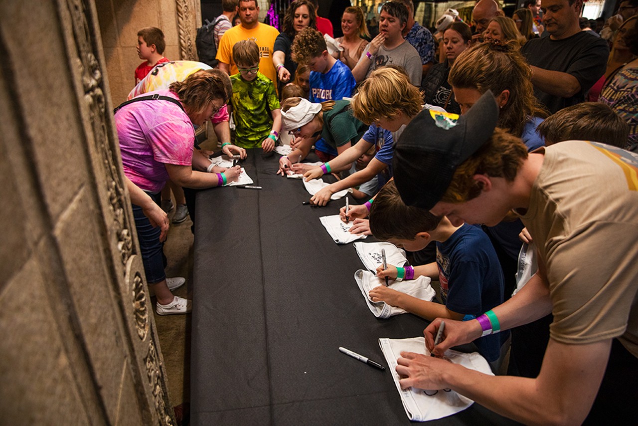 A group of people sign their underwear to commemorate the record-setting event.