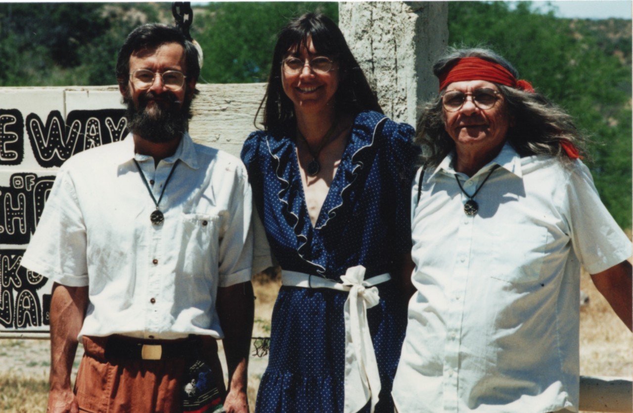 Peyote Way Church founder Immanuel Trujillo (right) with Reverend Anne Zapf and Rabbi Matthew Kent standing near the front gate of the church property.
