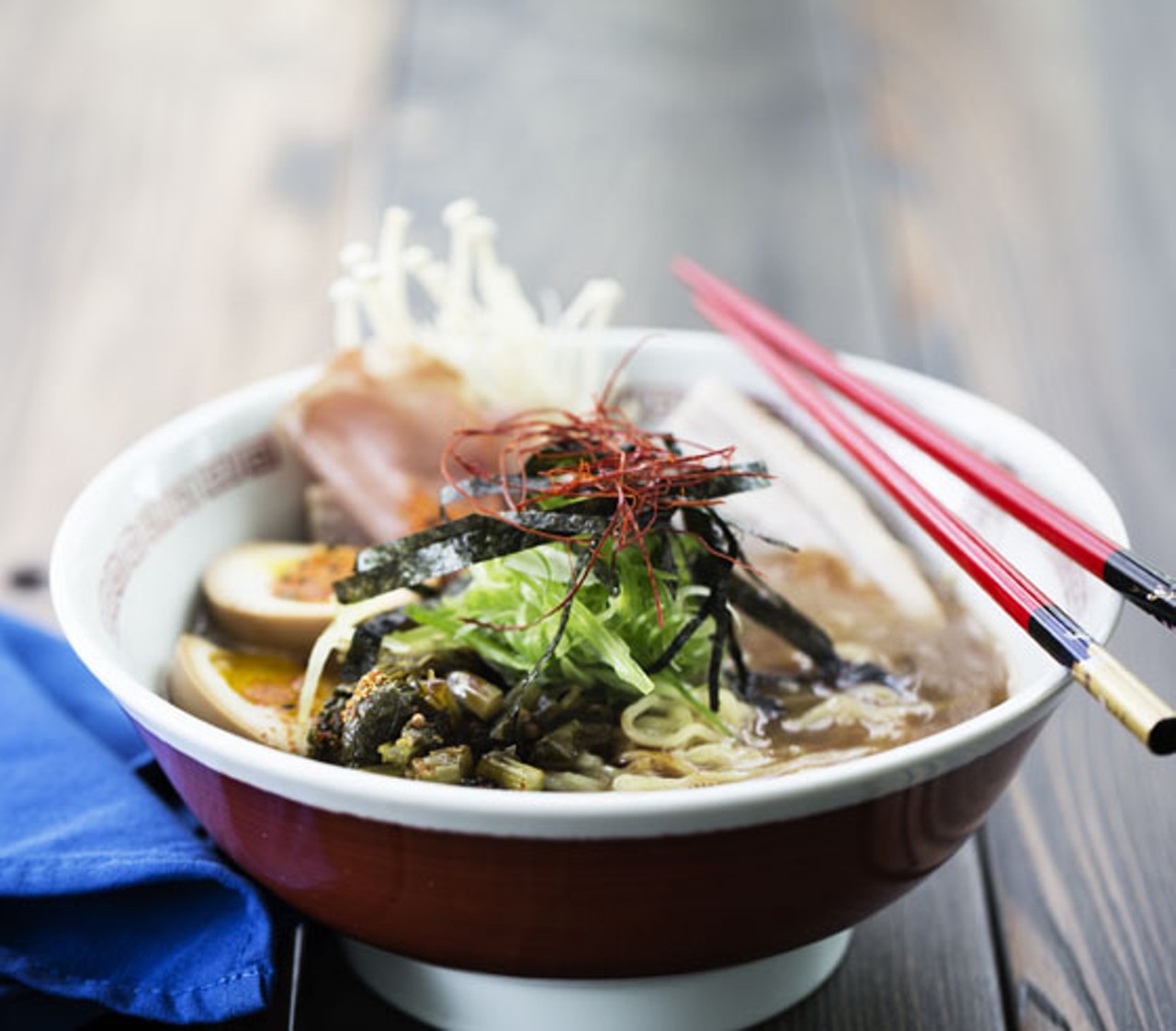 Tonkotsu ramen brings pork belly and loin, soft-boiled egg, black garlic oil, mushroom, noodles.