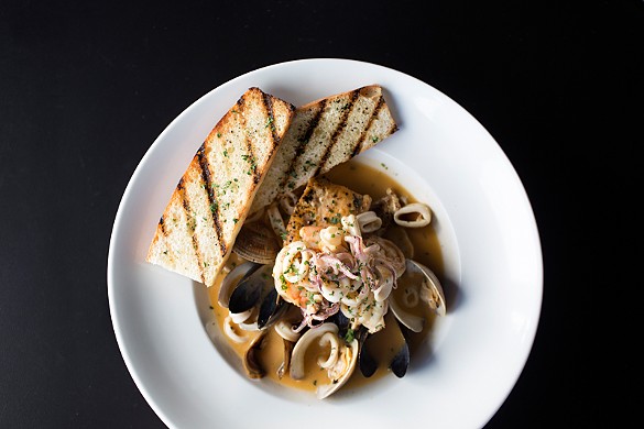 The seafood stew is made with mussels, clams, fish, shrimp and calamari in a tomato-saffron broth.