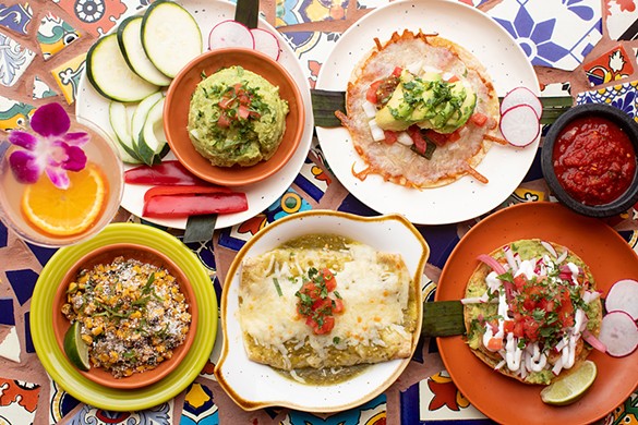 A selection of items from Diego's: guacamole, costra de chiles asados, esquites, enchiladas verdes and shrimp tostada.