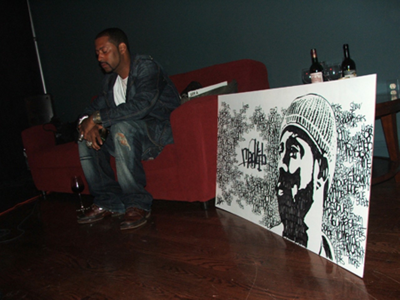 A quiet moment before Madlib's set.   On the right is a portrait drawn by a fan in what appeared to be Sharpie marker.
