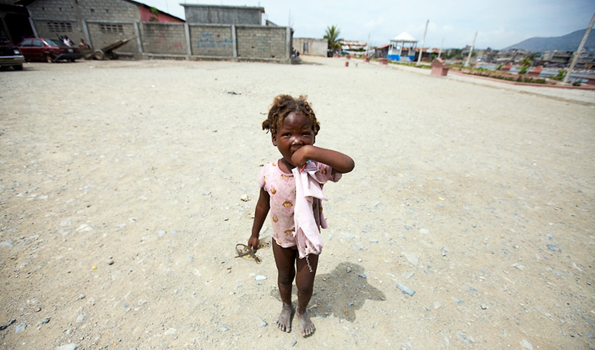 A little girl in the Cap-Ha&iuml;tien slum Shada. See more photos from Haiti.