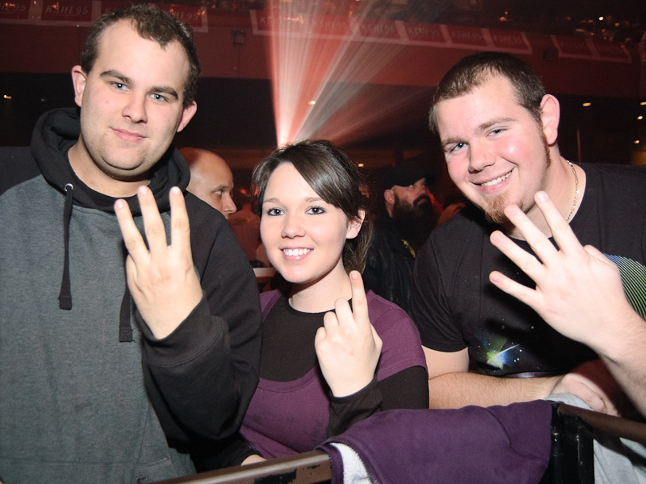 Chad Hanebrink, Loretta Williams and Greg McDaniels show us how many times they've been to the annual El Monstero show.