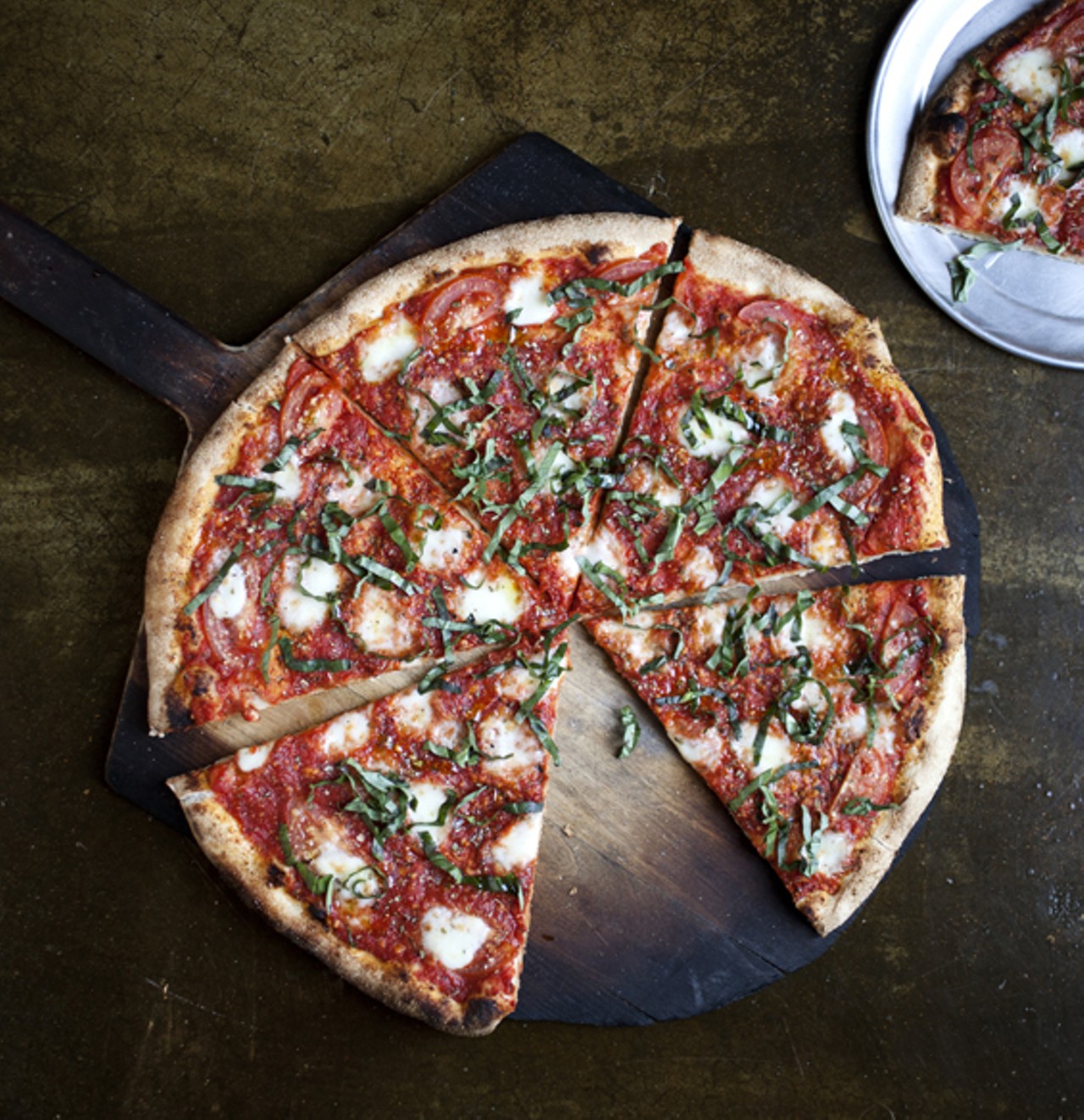 The Margherita pizza has tomato sauce, fresh mozzarella and basil.