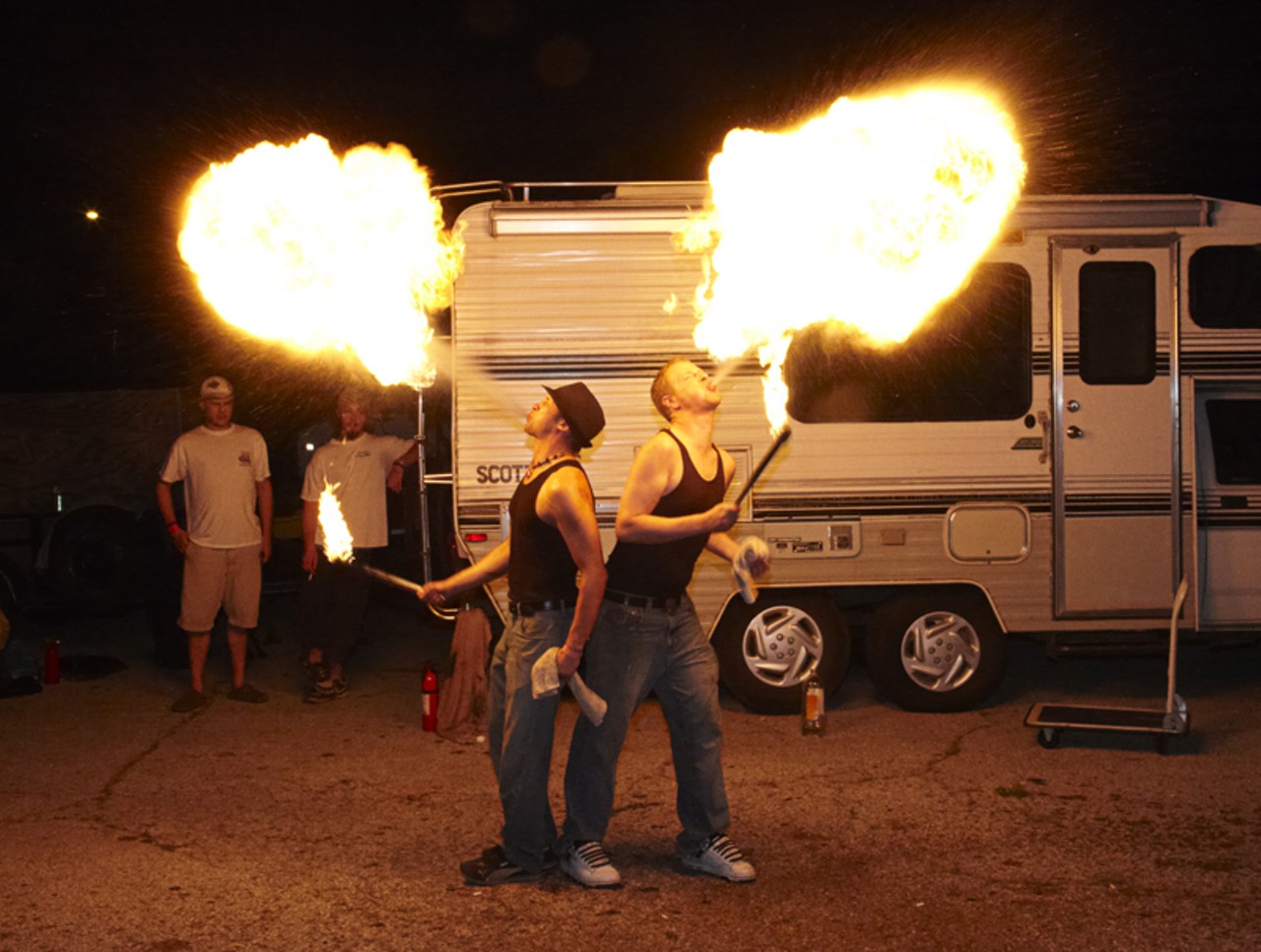 Fire-breathers at a World Hula Hoop Day party on 9/9/09 have no apparent regard for the safety of the people who live in that trailer behind them. See more photos.