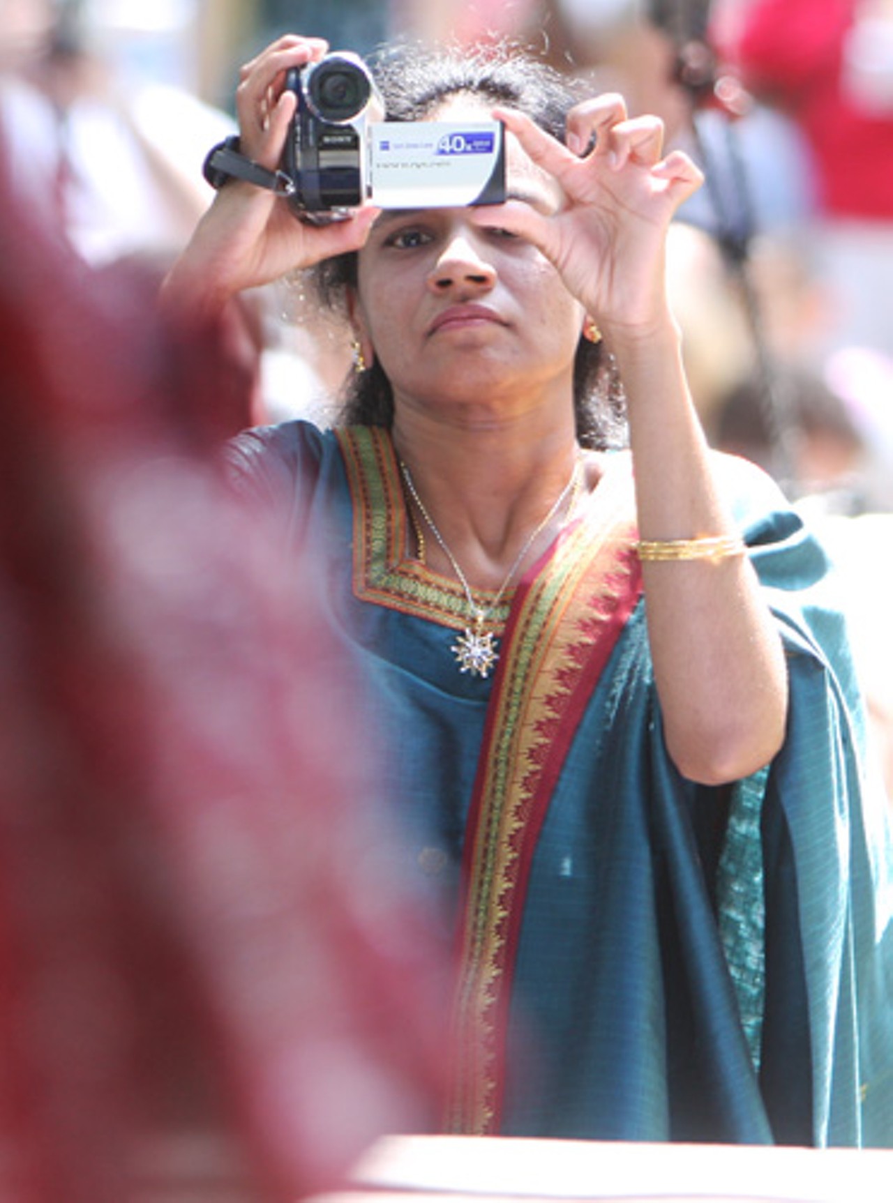 Madhavi Shaukaiahgari, India, videotapes her children perform.