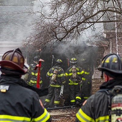 Firefighters enter a home after extinguishing a fire on Friday, Jan. 26, 2024, in Florissant.