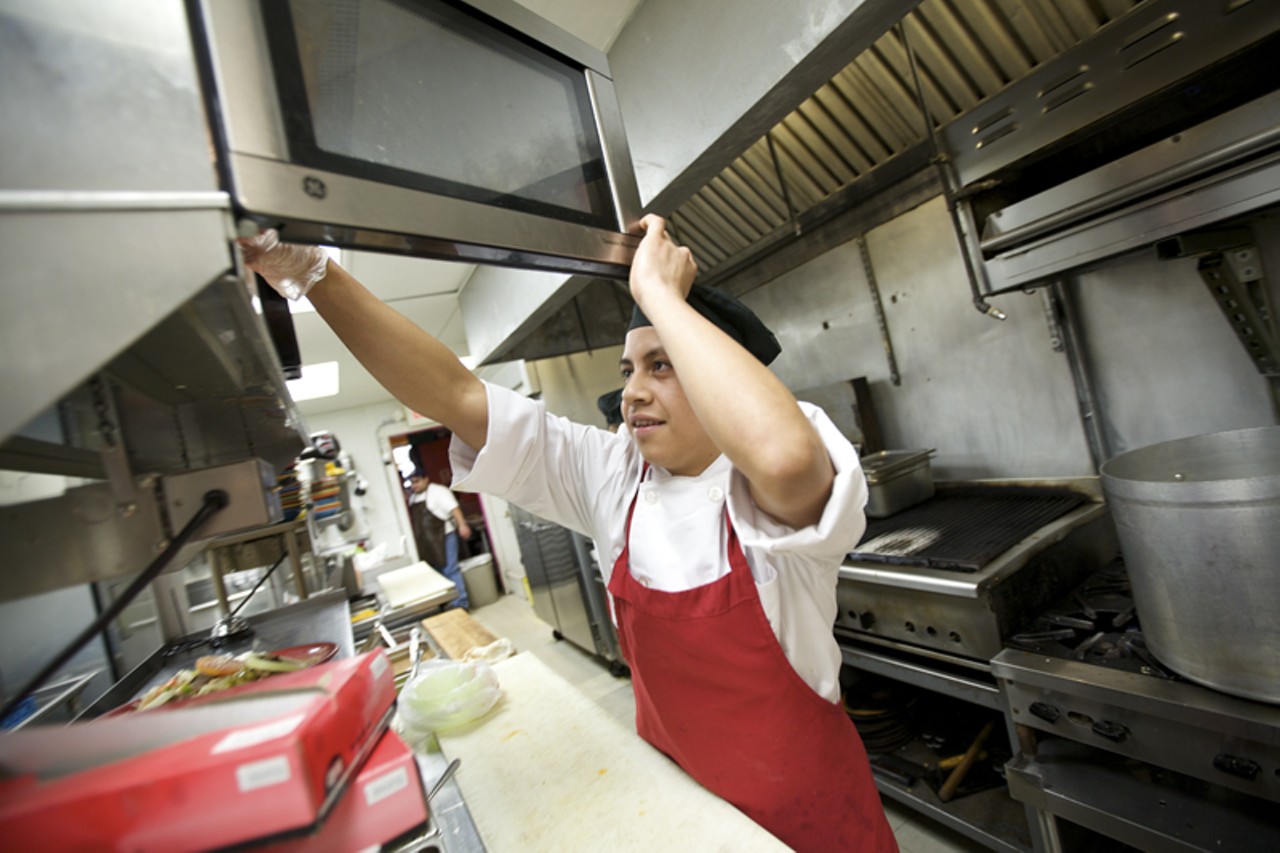 Mauri Rivera, a line cook at Las Palmas, at work in the kitchen.