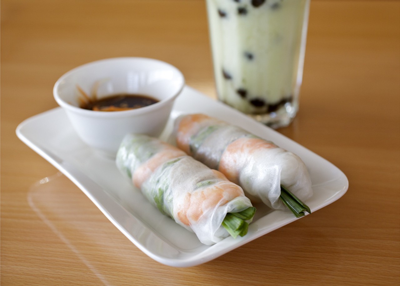 Goi cuon, the spring roll appetizer, is shown here with a fresh avocado smoothie with boba added. Boba are the tapioca balls also commonly found in bubble tea.
