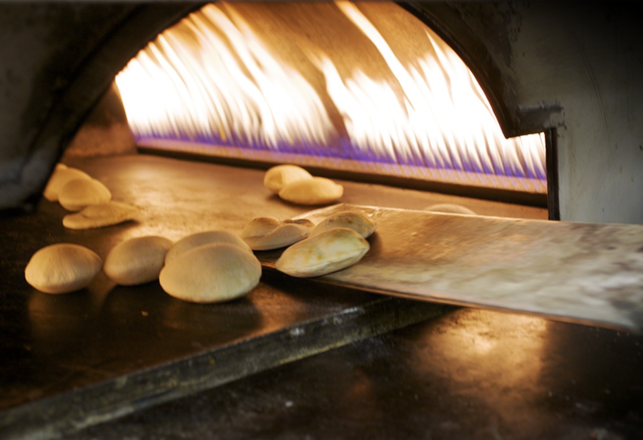 Fresh pitas baking in the oven. The dough is made every morning in-house, and then baked throughout the day.