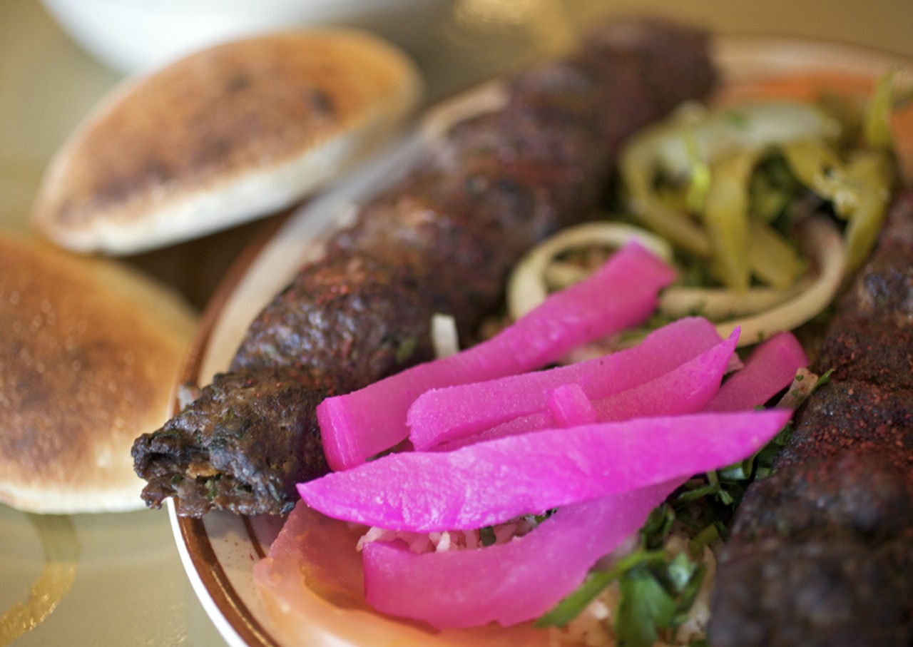 The Kafta kabob is grilled Lebanese Kafta, which is lean ground beef, parsley, onions, garlic and spices served with rice and vegetables and fresh pita bread.