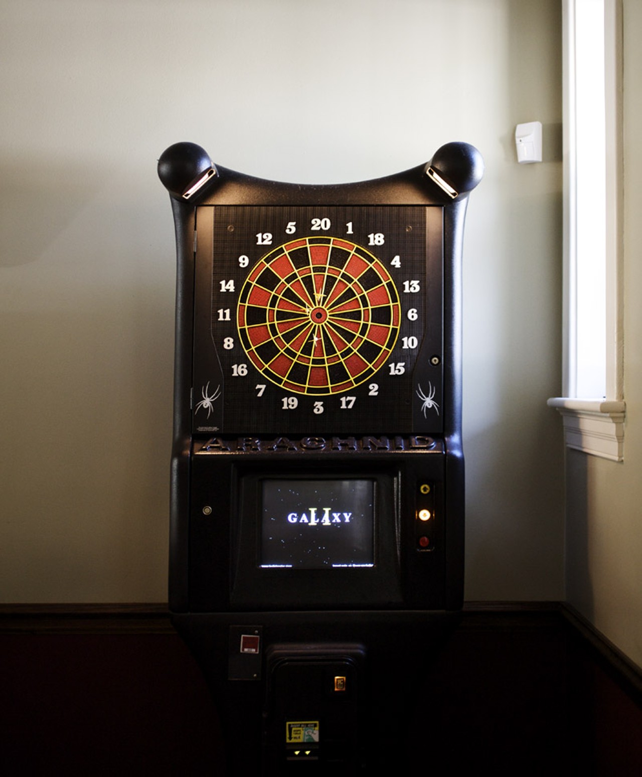 In the bar area of the restaurant there is a jukebox and dart board (shown).