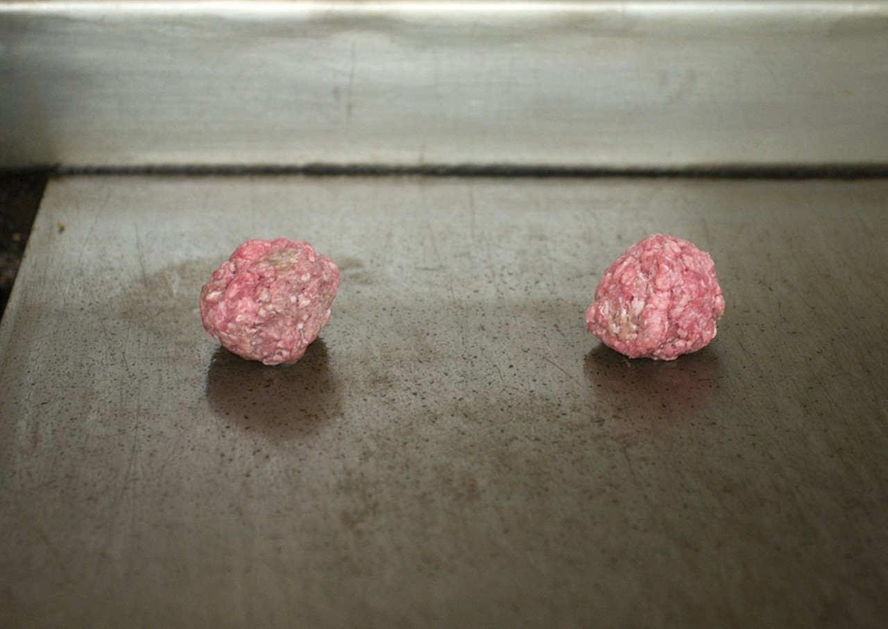 Making burgers: essentially you start with two healthy sized balls of meat.