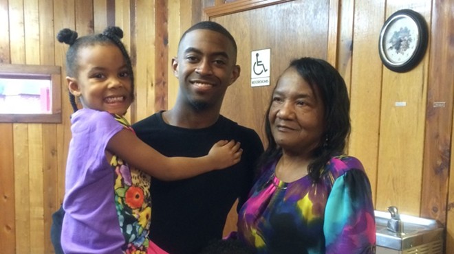 Kendrick Woods with his niece and grandmother.