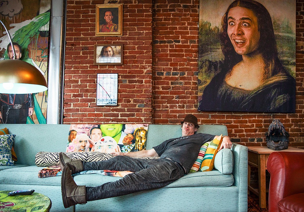 Homeowner Jack Saline relaxes on his Nic Cage-themed couch.