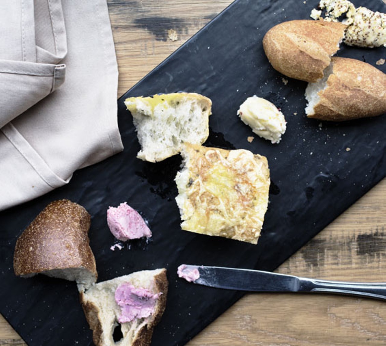 Gamlin's bread board includes beer bread, foccacia and baguette, all made in-house and served with your choice of butters. Shown here are the roasted marrow, mustard, and autumn butters.