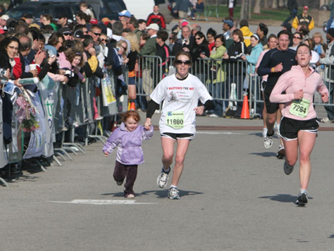 Kellee Marshall grabs her daughter, Kalee, with .1 mile left to cross the finish line together.
