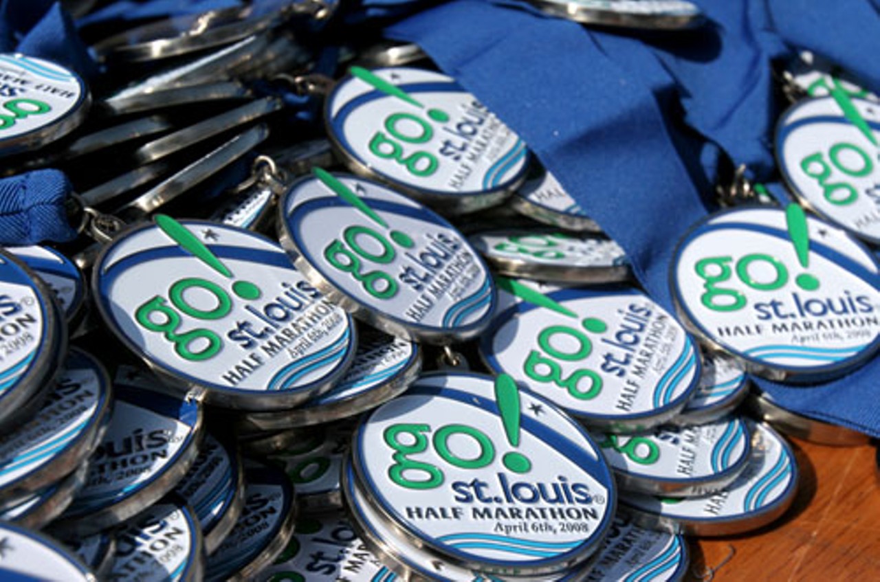 Thousands of medals sit on tables ready to be given to participants for completing the race.
