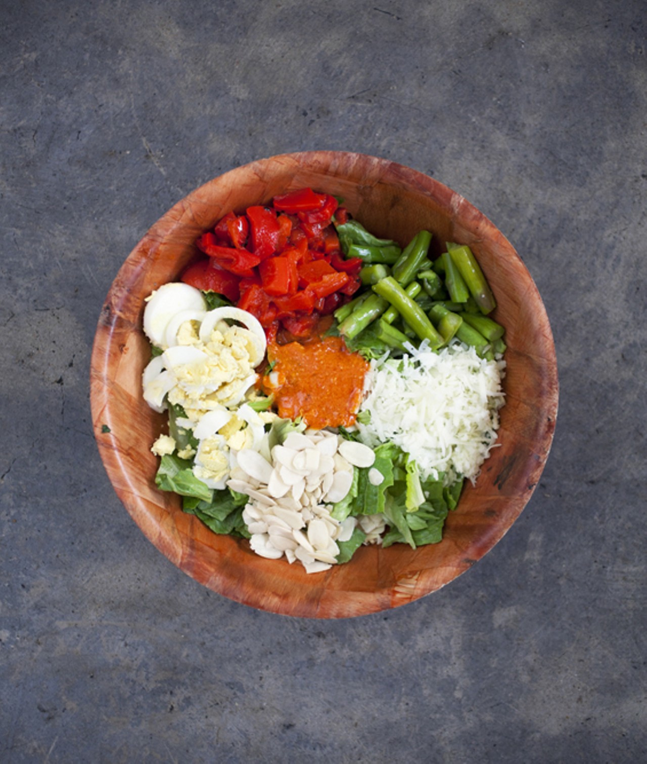 The Barcelona - romaine, roasted red peppers, asparagus, almonds, manchego, egg and their house-made romesco dressing.