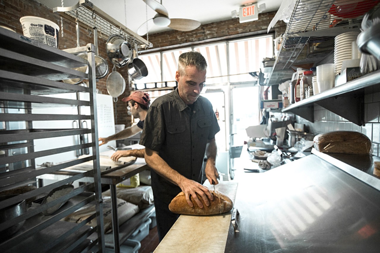 Barry Kinder slices the freshly made bread from Red Fox Baking.