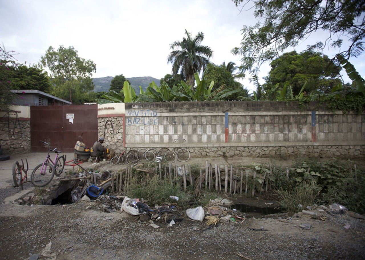 Drainage ditches line the road in Cap-Haitian, Haiti.