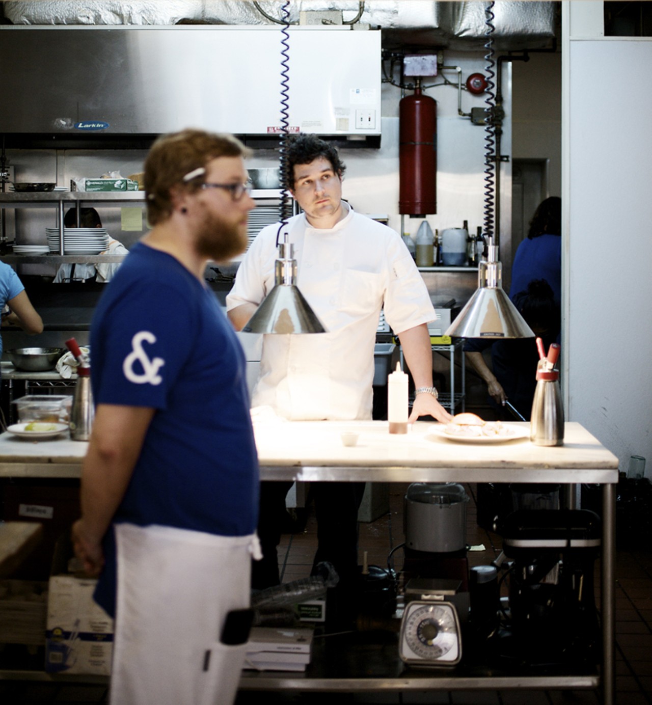 In the open kitchen is chef/owner Mike Randolph. Server Jeff Moll keeps an eye on his tables.