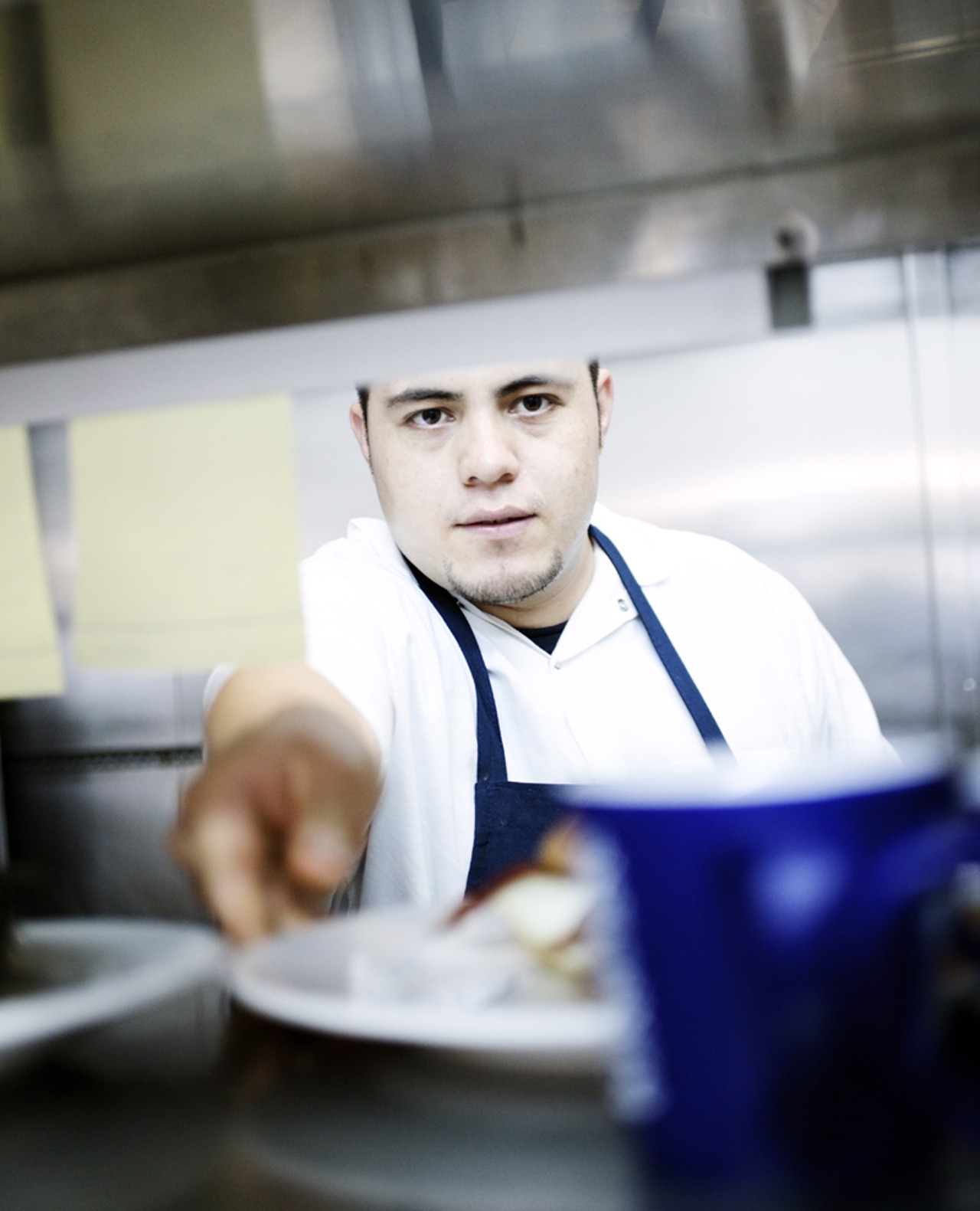 Line Cook Francisco Lopez in the kitchen of Half & Half.