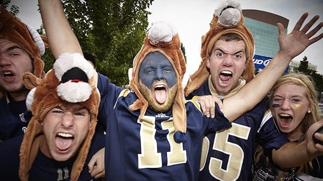Group of excited people in Rams jerseys