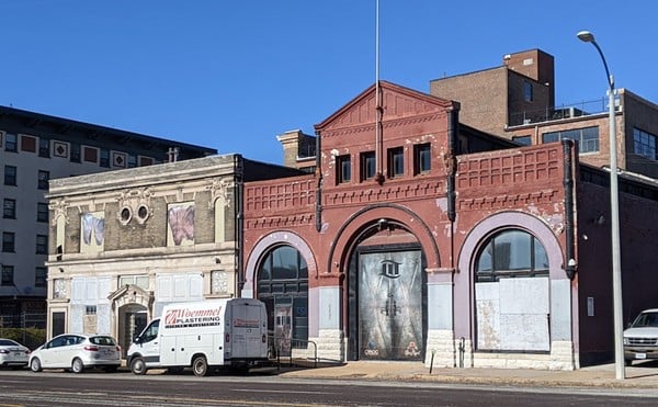 Preservationists hope to save the buildings at 3223 Olive Street, left, and 3221 Olive.
