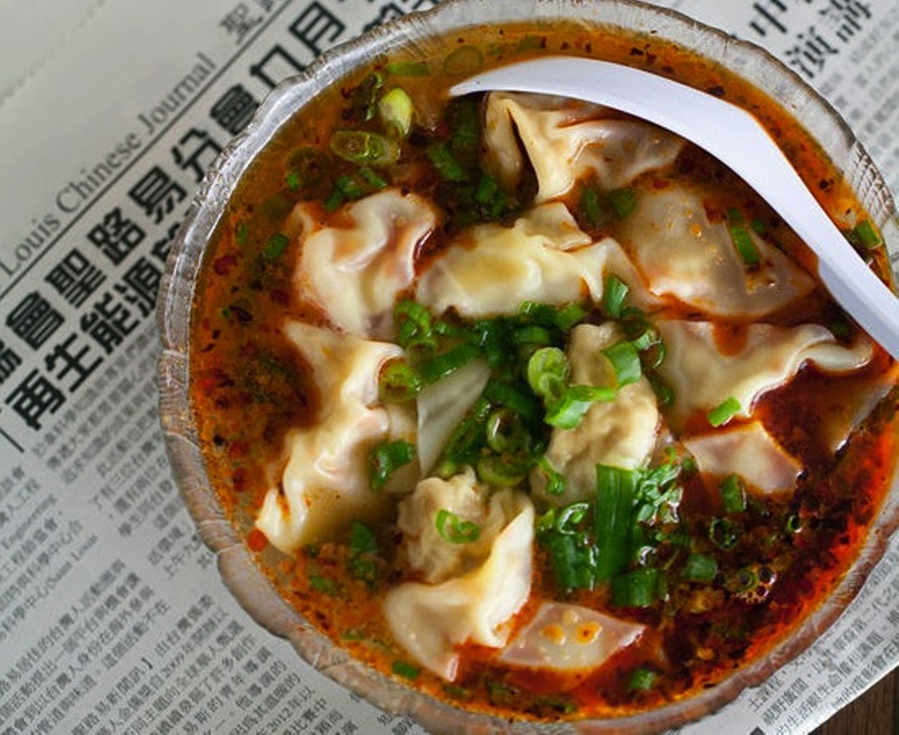 6. "Spicy Wonton Soup" at Famous Szechuan Pavilion
"Spicy Wonton Soup" betrays its chile heat in the vivid orange-red of its broth, in which bob plump little wontons stuffed with ground pork.