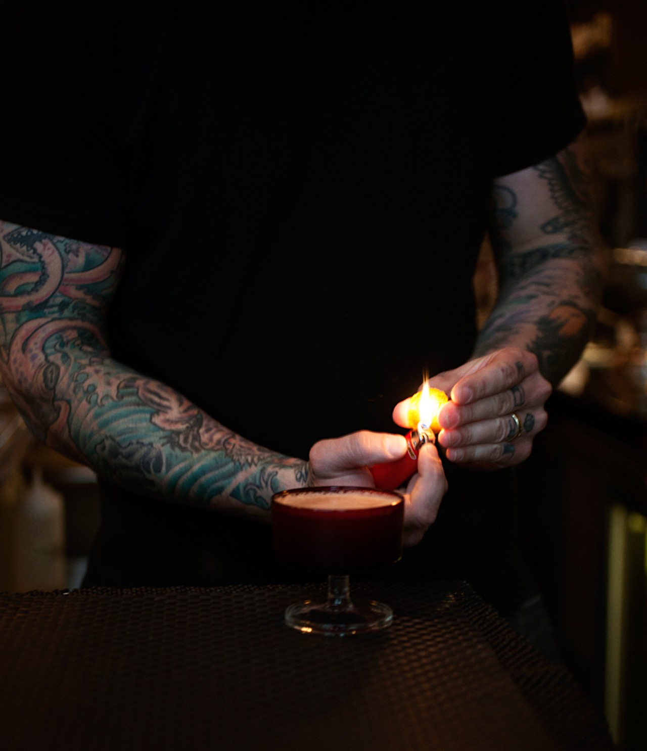 Blood & Sand's Lucas Ramsey mixes cocktails behind the bar.