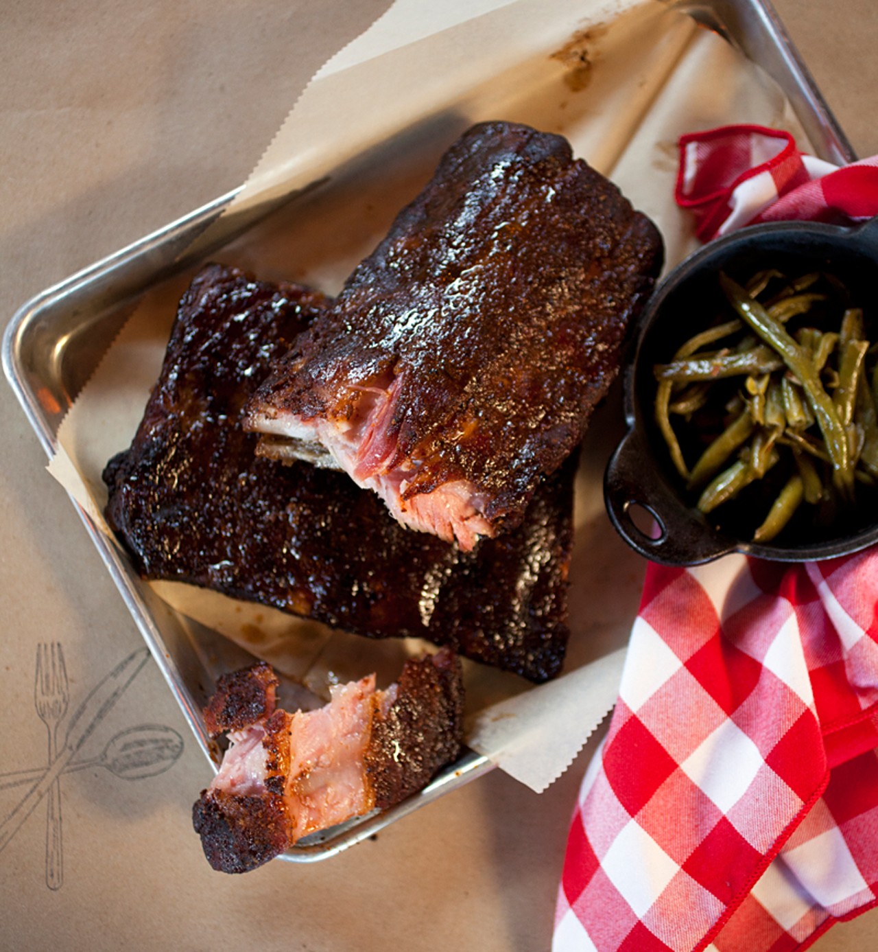 The "Half & Half" is half-rack of St. Louis-style and half-rack baby-back ribs, shown with a side of green beans.