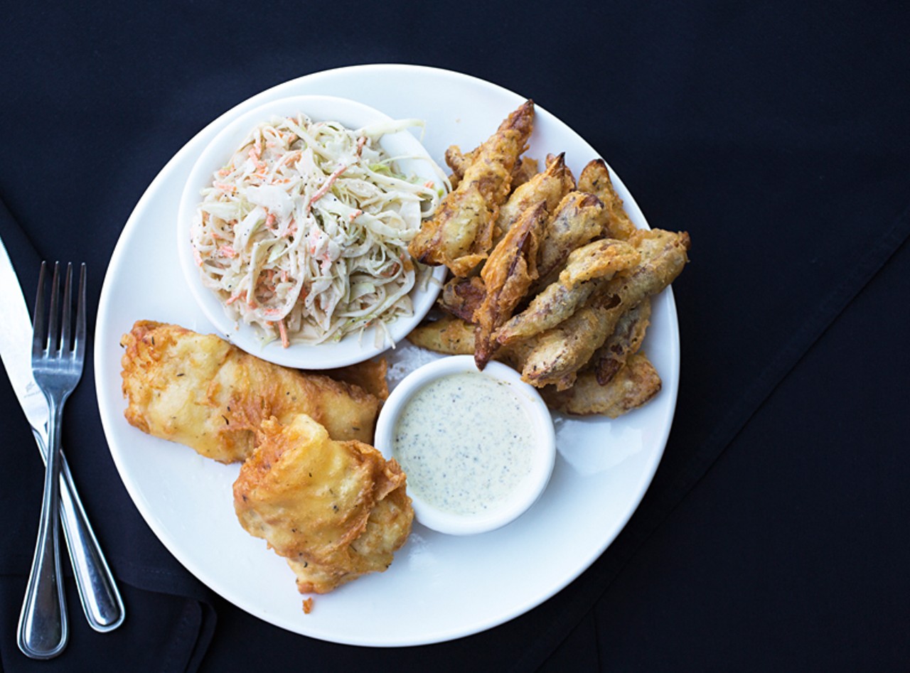 The fish and chips is fresh cod that's hand-dipped in beer batter, served here with fried potato wedges, cole slaw and tartar sauce.