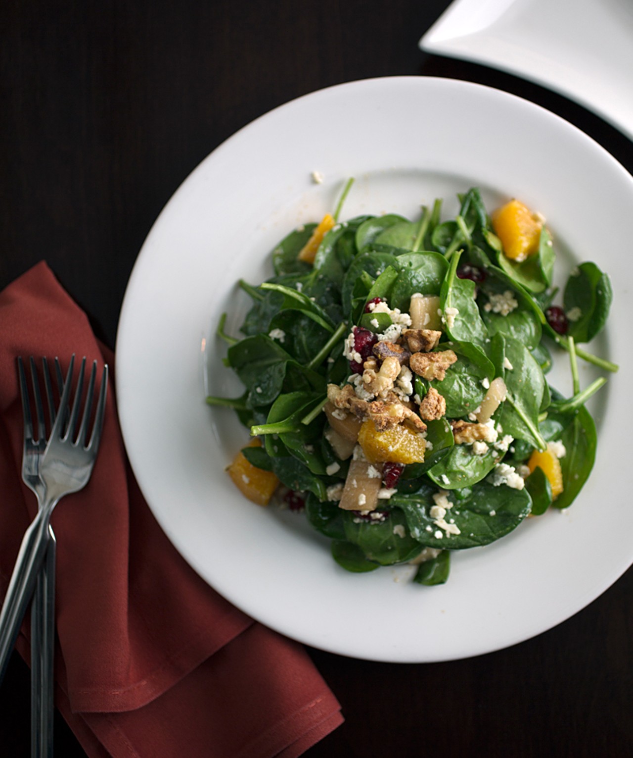 Spinach Salad with candied walnuts, pear, cranberries, gorgonzola and pomegranate vinaigrette.