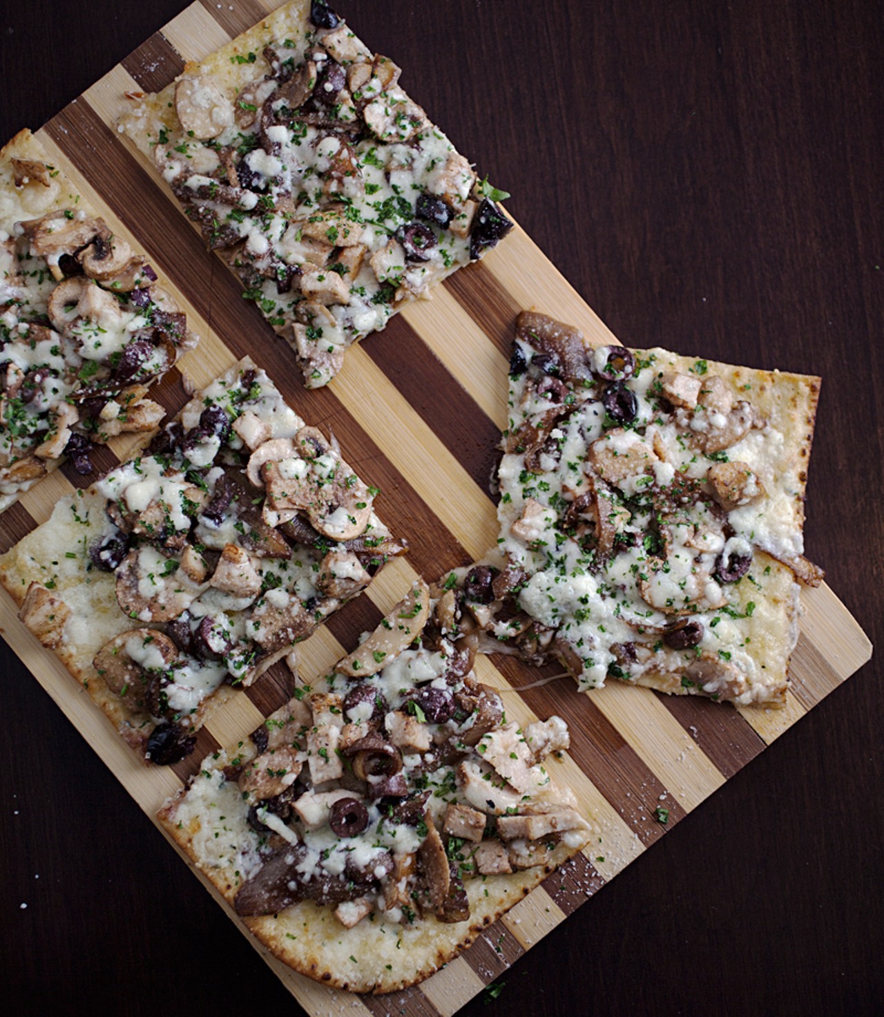 Pan D'Olive flatbread with chicken, mushrooms, olive, gorgonzola and caramelized onions.