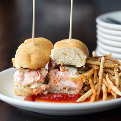 The lobster roll comes with white truffle mayo, shaved celery, matchstick fries and tomato jam.