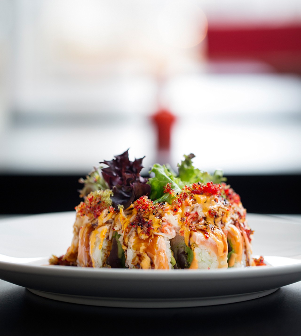 "James Laurinaitis" maki  is a combination of tuna, cucumber, avocado and soy paper, topped with seared salmon, spicy crab, eel sauce, spicy mayo and tobiko.