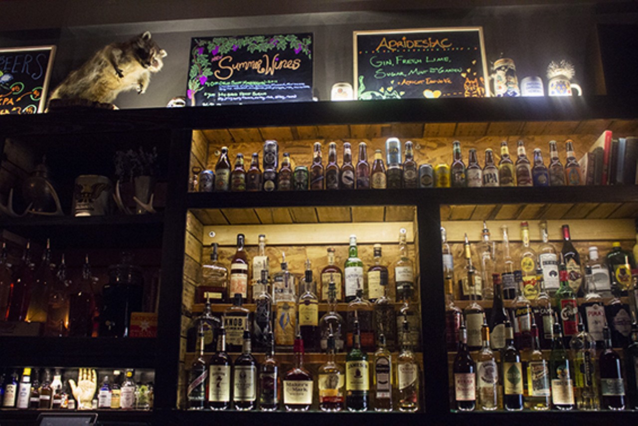 The Fortune Teller Bar carries a wide selection of beer and spirits, including house infusions on  atop the handcrafted shelving built by co-owner and carpenter Sam Coffey.