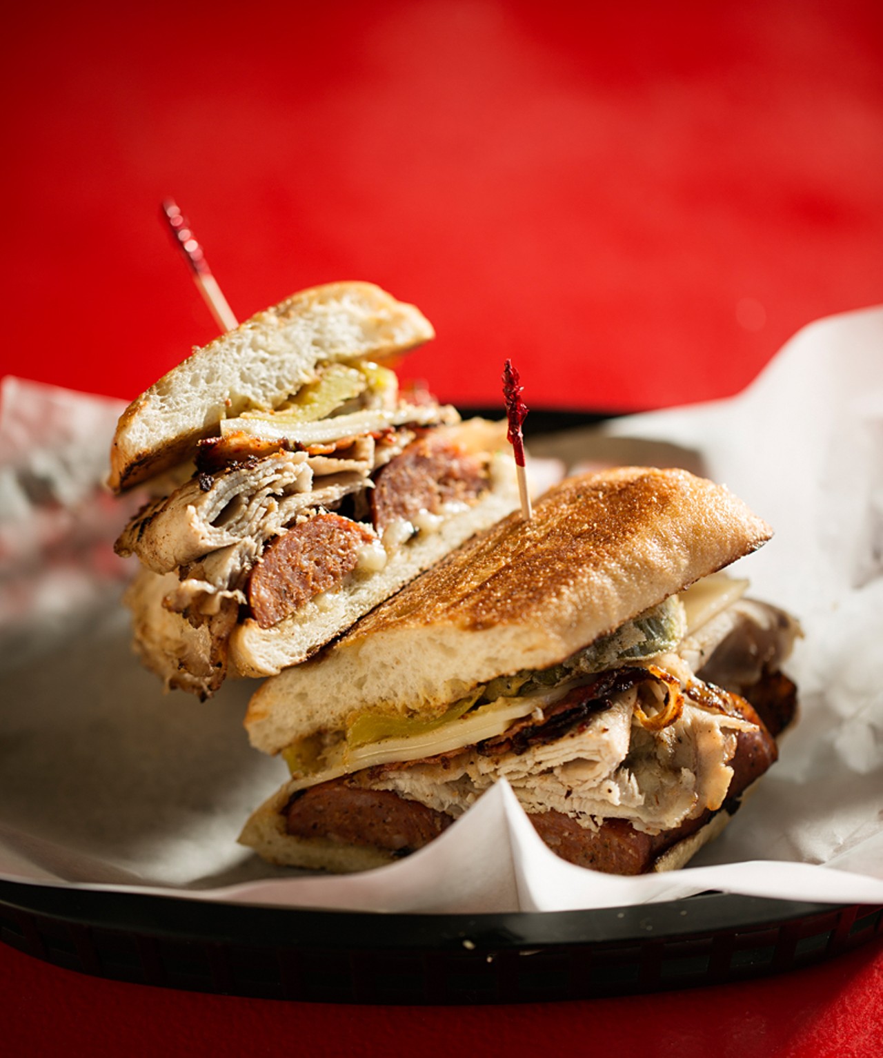 The Pat "Say Jack" is grilled andouille, roasted pork loin, jalapeno bacon, Swiss and pepper jack cheese, with stone ground mustard, fried pickles and fried banana peppers.