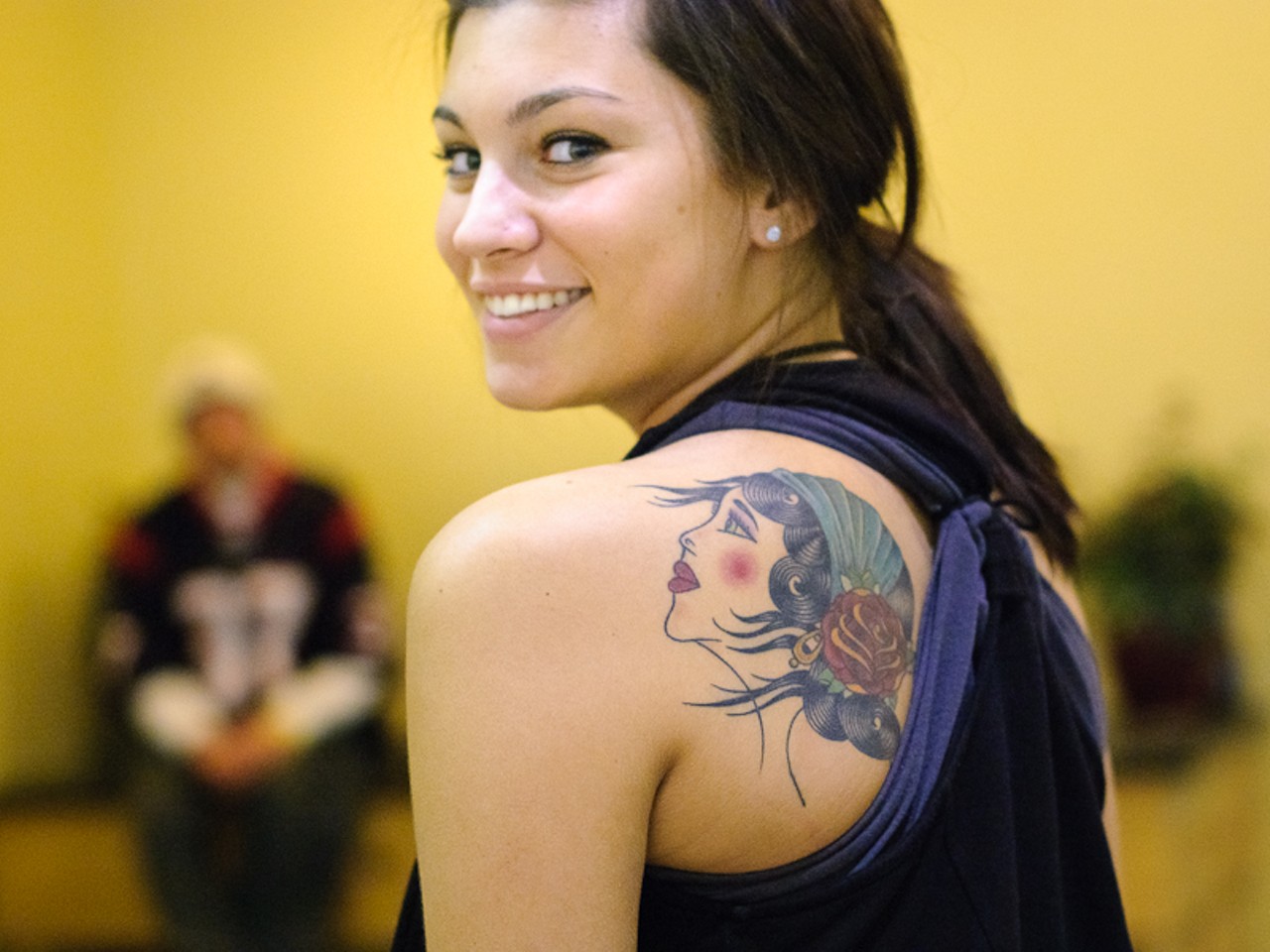 Melyssa Rapley from Waterford, Michigan shows her winning Small Colored Tattoo -- with green eyes that match her own.