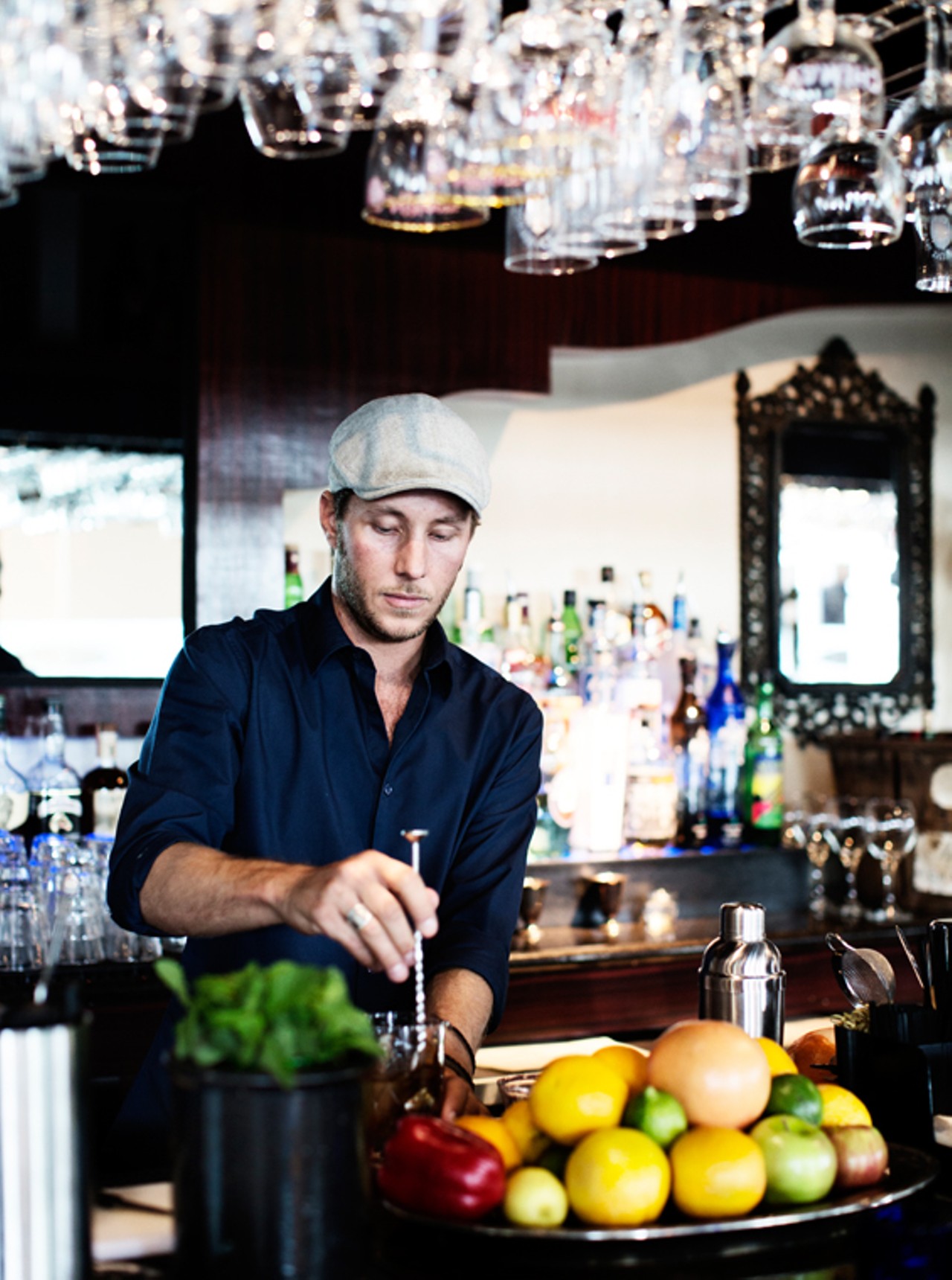 Terry Oliver, one of the owners and the bar manager, behind the bar at Tripel. He's preparing a "Tripel Fashioned."