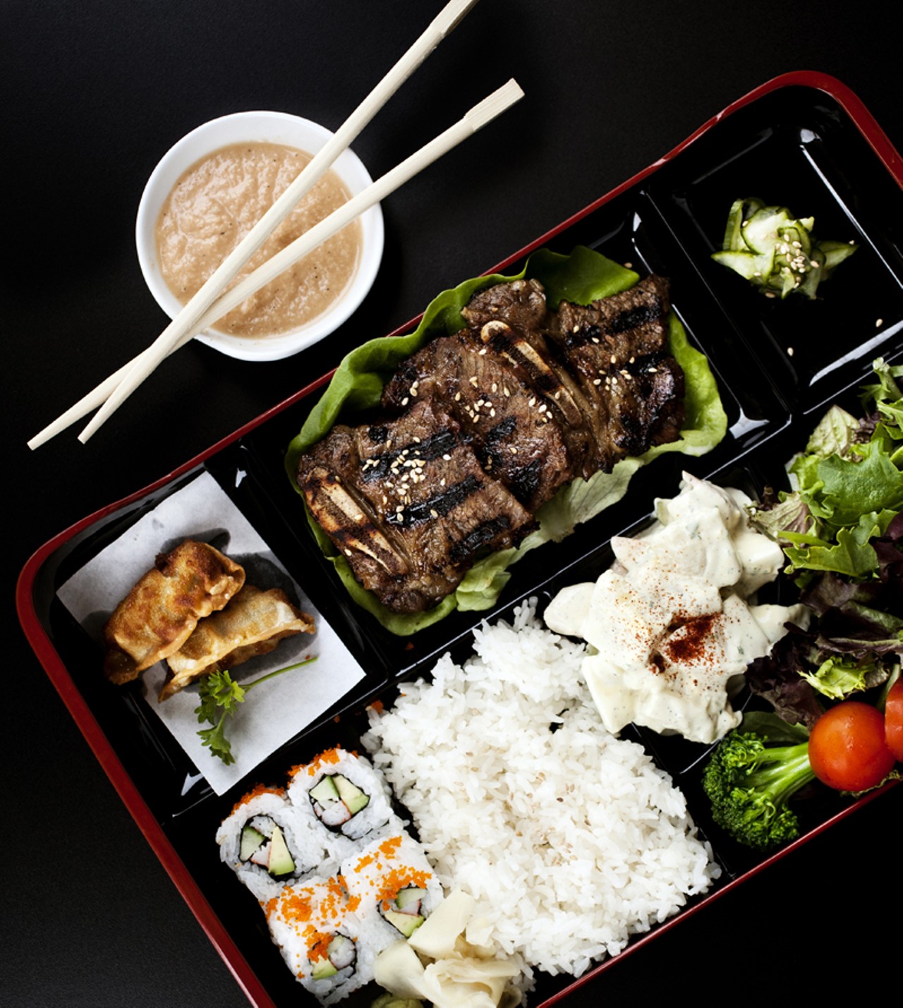 The Kalbi (beef short rib) bento box comes with two pieces of gyoza, four pieces califronia roll, potato salad, sunomono (cucumber salad) and house salad.
