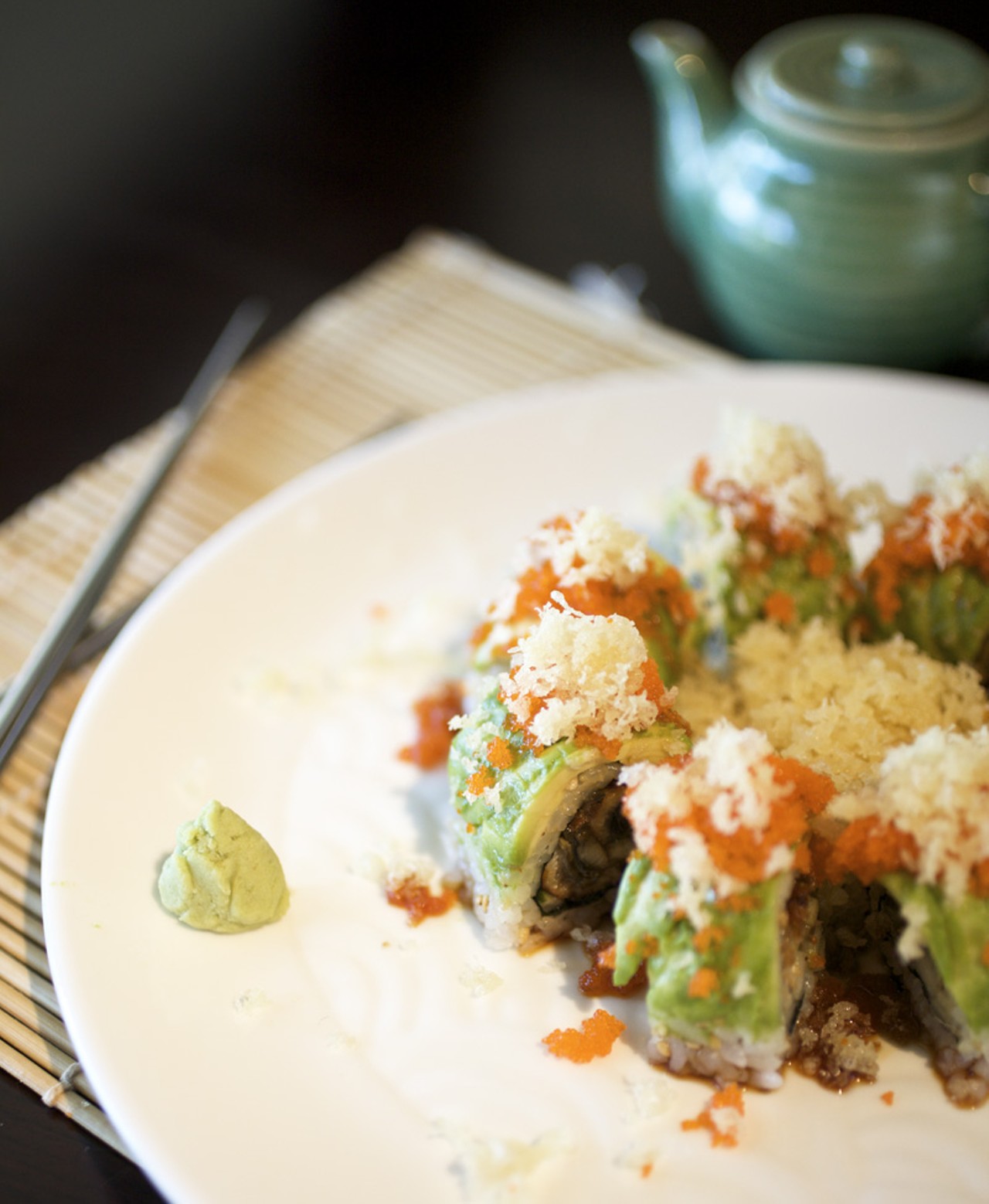 A closer shot of the Green Dragon Roll, which is eel, cucumber and avocado topped with masago and tepura flakes.