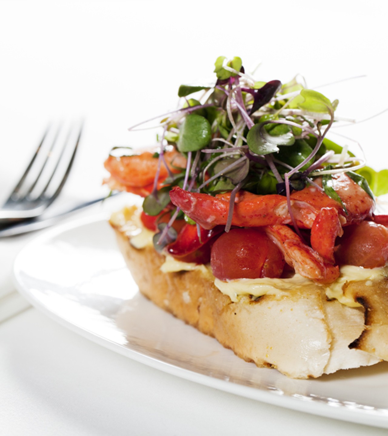 From the "to start" menu is the lobster "knuckle sandwich" with tarragon and tomatoes.