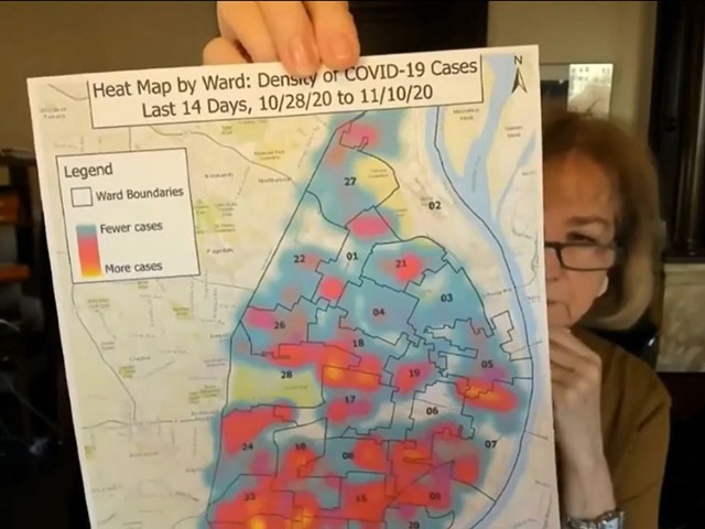 St. Louis Mayor Lyda Krewson holds up a new COVID-19 "heat map" of St. Louis City.