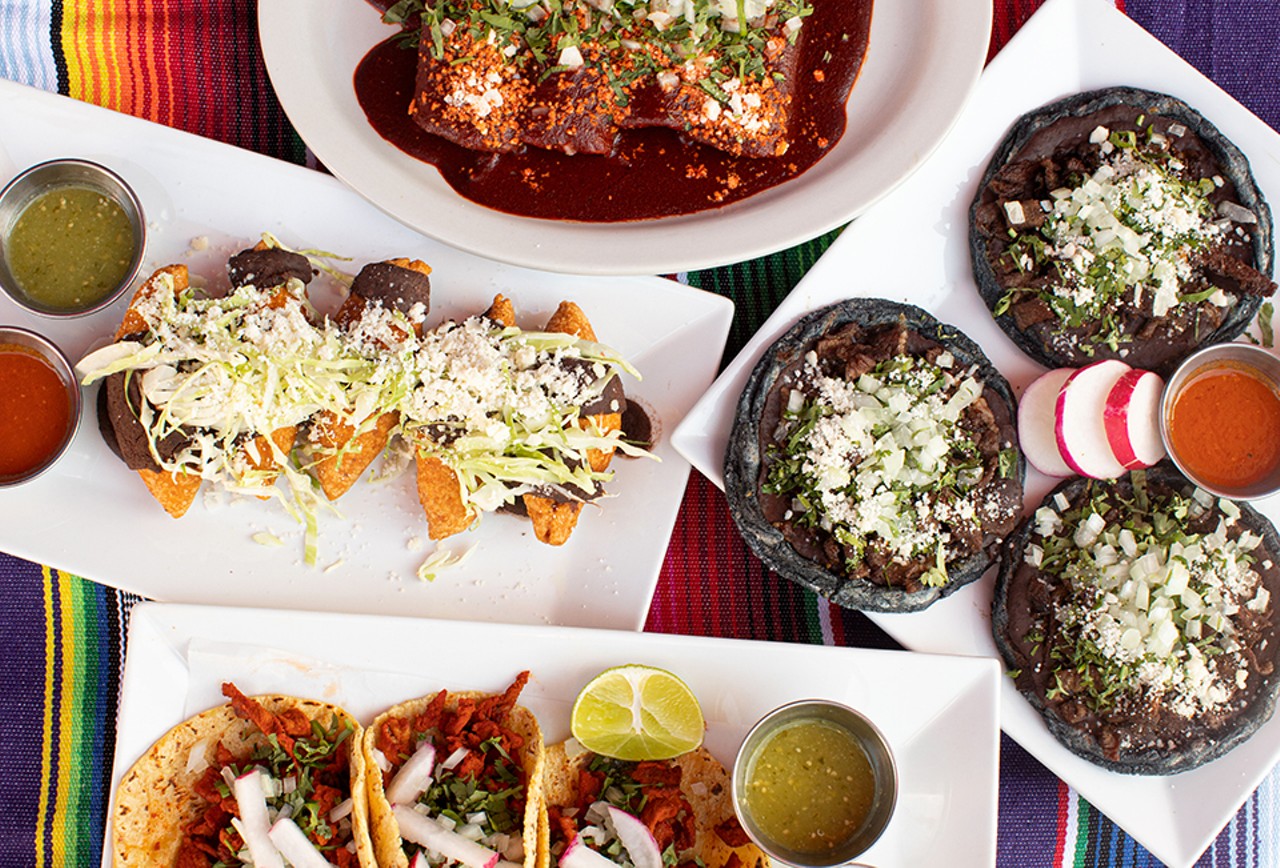 A selection of dishes from La Oaxaqueña (clockwise from top): enchiladas de mole, picaditas, street tacos and molotes.